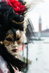 Venice, Italy - February 16, 2020: An unidentified person in a carnival costume in Piazza San Marco attends at the Carnival of Venice.