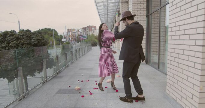 a young couple quarreled during a date and the girl hit the guy with a bouquet