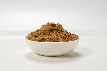 Mix spices in a bowl isolated on white.