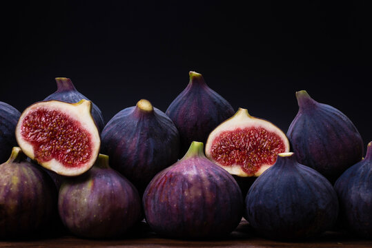 Tasty figs on a black background. Top view.