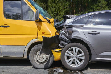damaged cars on the highway at the scene of an accident