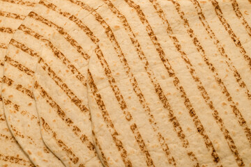 Grilled pitta bread isolated on white background.