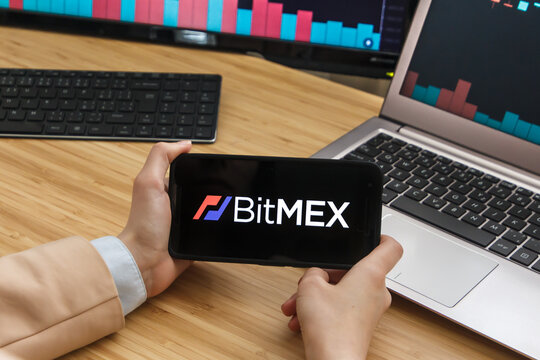 SAN FRANCISCO, US - 18 May 2019: Female Trader Hands Holding the Smartphone Using Application of BitMex Cryptocurrency Exchange Market. San Francisco, California, USA