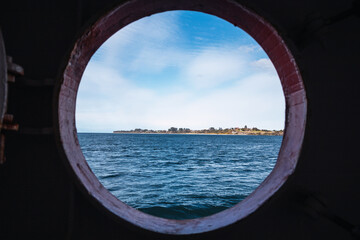 a view of and islan of south america from a boat window