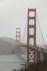 vertical photo of Golden Gate Bridge during a cloudy day