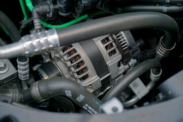 Alternator in engine bay of a car