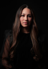 Fototapeta premium young woman over a black background