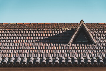 Dormer window on a terracotta tiled roof