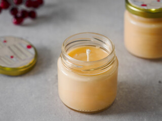 Orange scented candles. The winter atmosphere. Space for text. Comfort and fragrance. Aromatherapy. New Year, Christmas.