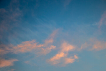 Turqoise sky with firey pink clouds at sunset - background - room for text - good for replacement