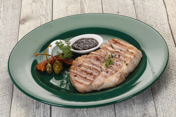 Grilled pork steak with pepper sauce