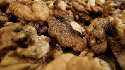 Heap of raw walnuts close-up as background. Walnuts close-up.Walnuts as background.
