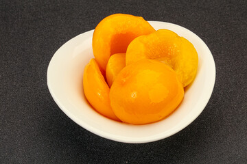 Marinated peaches fruit in the bowl