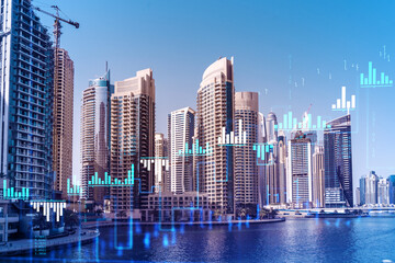 Skyscrapers of Dubai business downtown. International hub of trading and financial services of Western Asia. FOREX graph and chart concept. Double exposure. Dubai Canal waterfront.