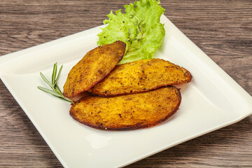Baked potato with herbs and spices