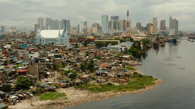 Manila is the capital of the Philippines with slums and poor district and skyscrapers and modern buildings.