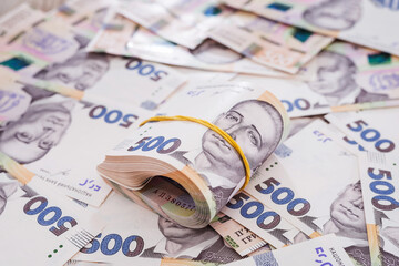 500 hryvnia tied with an elastic band.