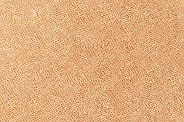 abstract background of beige knit fabric texture close up