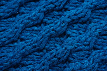 Deep blue background of large knitted thread pattern