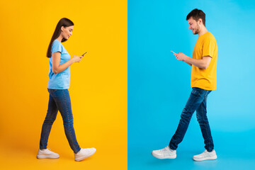Portrait of young couple using their smartphones