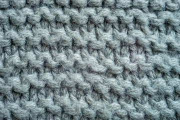 Grey background of knitted thread pattern