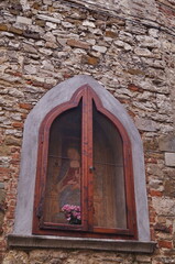 Religious shrine in the ancient medieval village of Montefioralle, Tuscany, Italy