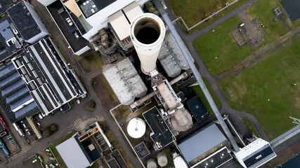 Coal central aerial drone shot chimney pipe energy recovery plant Hemweg in Amsterdam The Netherlands industrial facility