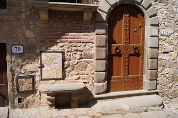 Entrance door of a house in the ancient medieval village of Montefioralle, Tuscany, Italy