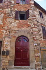 Entrance door of a house in the ancient medieval village of Montefioralle, Tuscany, Italy