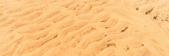 fragment of yellow sand on the sea coast