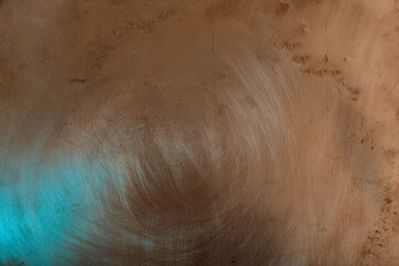 Copper surface with aqua color reflection. Randomly located. Abstract fantasy. There are scratches on the copper surface. Minimalism. Copy space. 
