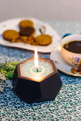 Burning candle on the table