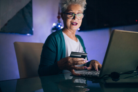 Woman Christmas shopping online with credit card