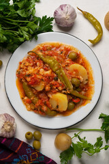 Mexican style cod called a la vizcaina on white background