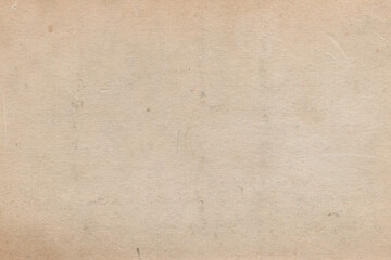 Vintage and old looking paper background. Retro cardboard texture. Grunge paper for drawing. Ancient book page.
