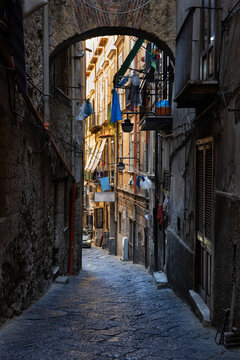 Italy, Campania, Naples, Narrow alley along old city houses