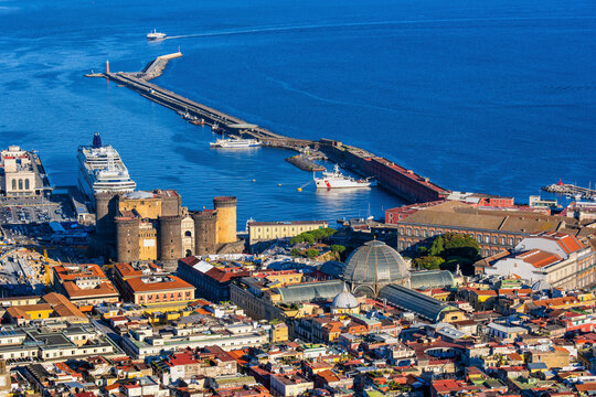 Italy, Campania, Naples, Aerial view of Castel Nuovo, Galleria Umberto I and pier in Gulf of Naples