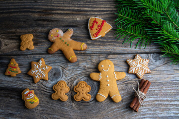 Christmas homemade gingerbread cookies over wooden table
