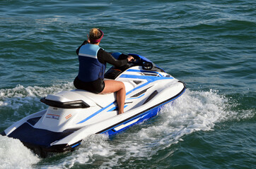 Fototapeta premium Young woman jet ski sider