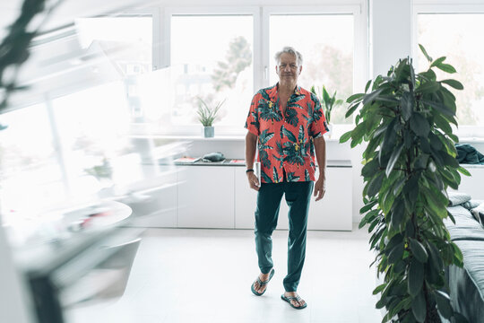 Businessman wearing casual walking against window art office