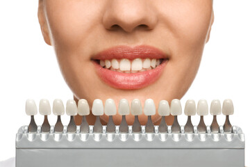 Woman checking her teeth color on white background, closeup. Cosmetic dentistry