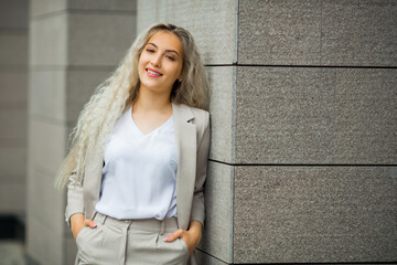 beautiful young female in a summer suit in the city