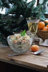 Naklejka na ściany i meble Traditional Russian Christmas Salad Olivier with champagne and tangerines