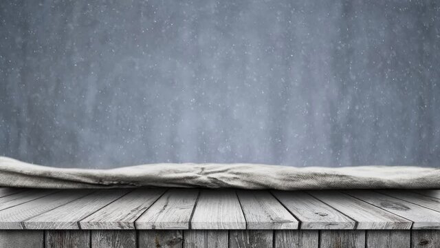 Empty wooden table with falling snow background