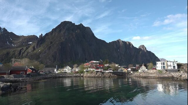 Norway. Lofoten Islands. Traditional red wooden houses, in the small fishing village. Fisherman's house on the shore of the fjord.