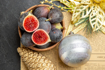 top view fresh figs with christmas tree toys on a dark background fruit color photo freshness tree