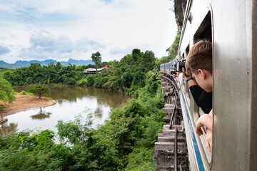death railway Bangkok - Erawan at the river Kwai - wooden bridge - view out of the window along the...