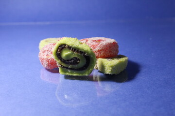 Rahat onion snail pastille lies slide on a blue background copyspace place for text