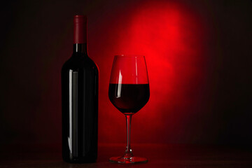 Glass red wine, bottle