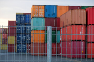 Cargo containers in a fenced cargo terminal - Stockphoto